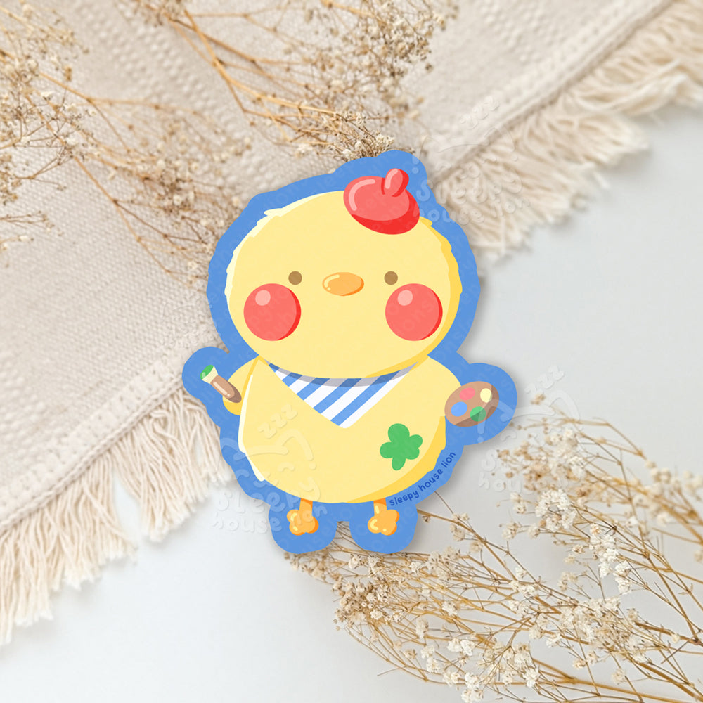 Cartoon chicken character with red cheeks and a blue border on a light background