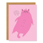 Greeting card with a pink cat illustration and text on a pink background