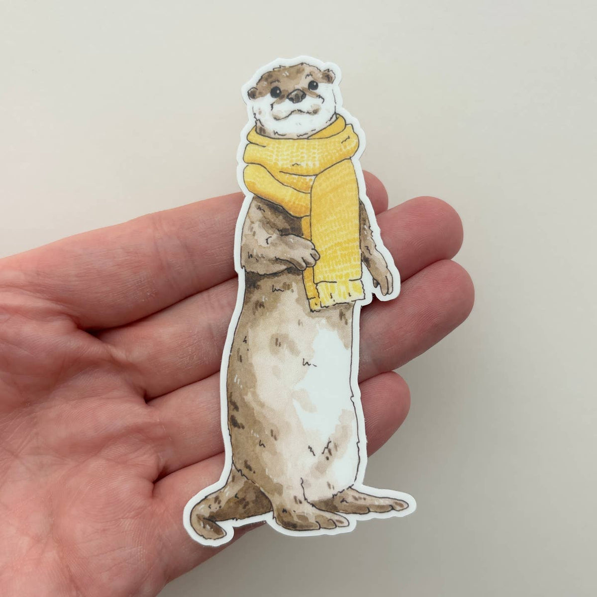 Cozy Otter in a Scarf Sticker