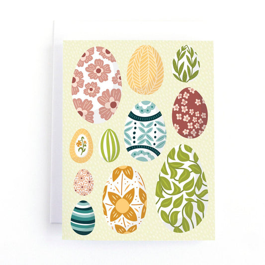 Card with patterned Easter eggs on a light yellow background
