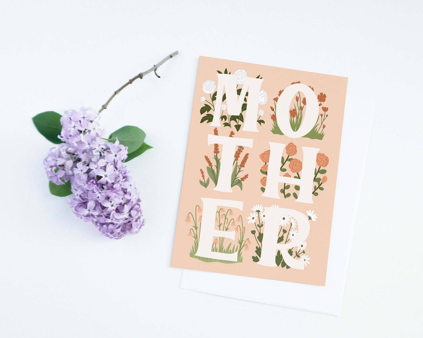 Card with floral design and 'MOTHER' text on a white background with purple flowers.