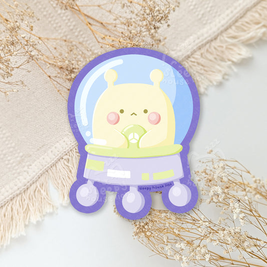 Cartoon character in a snow globe on a neutral background with dried flowers