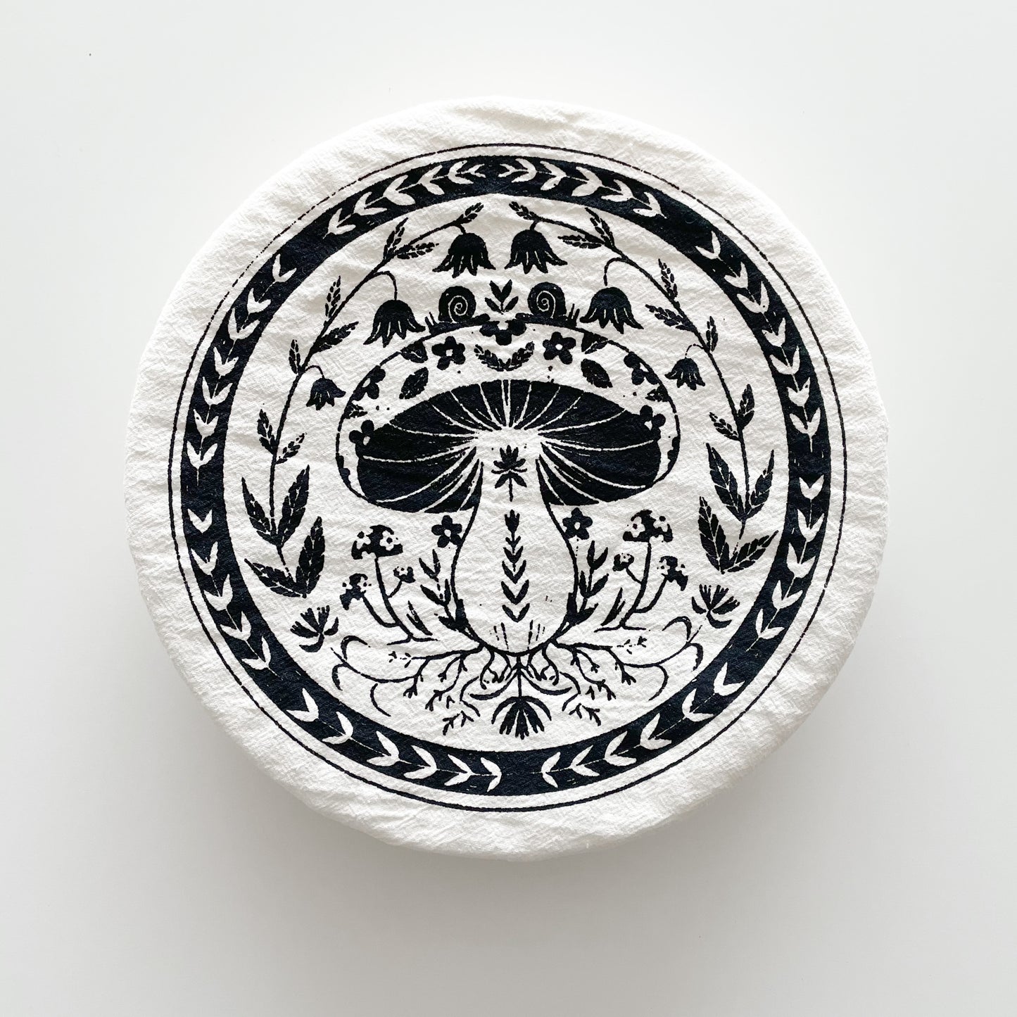 a bowl cover with a mushroom design