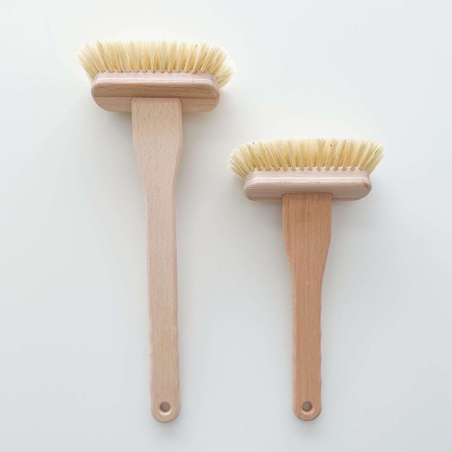 two bath cleaning brushes, one short, one long