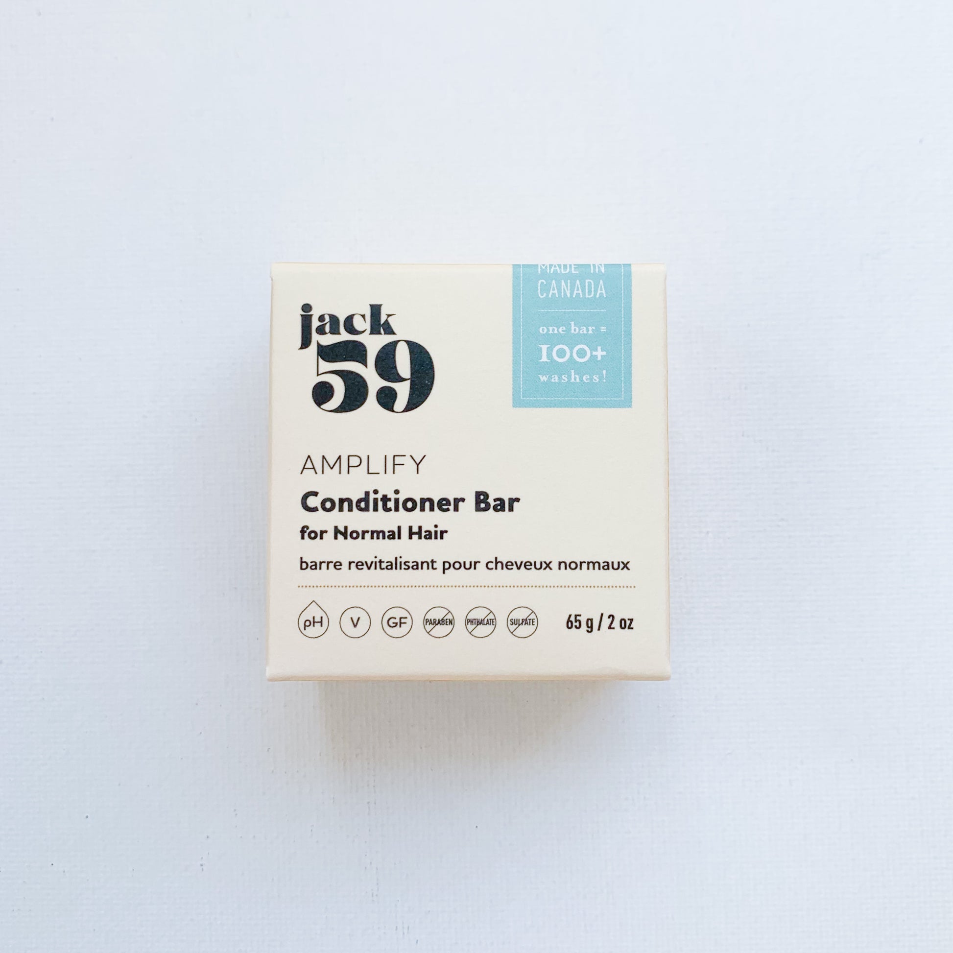A square, light yellow box with the text 'Jack59 Amplify Conditioner Bar for Normal Hair' written on it in black.