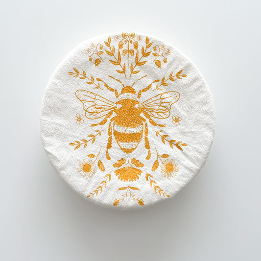 a bowl cover with yellow bee and floral design
